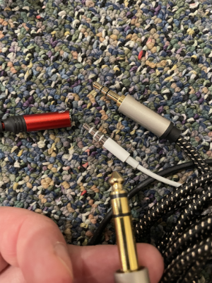 Audio plug, headphones, and speaker adapter